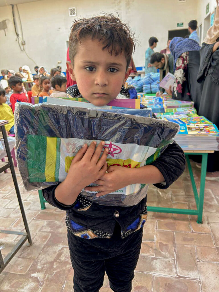 Grammar-School-Foundation-students-receiving-free-uniforms-and-books-in-rural-Pakistan