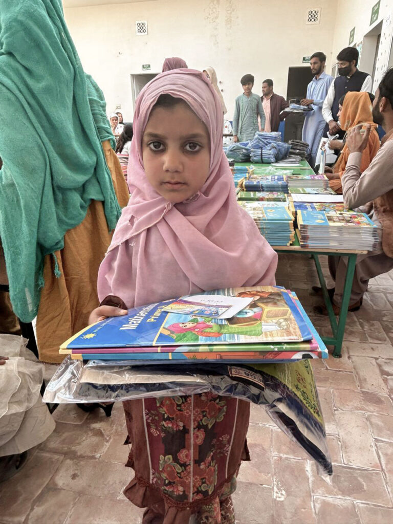 Nonprofit-school-distributing-books-and-uniforms-to-students-for-free-education-in-Pakistan
